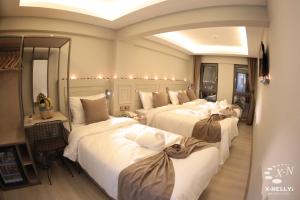 Postel nebo postele na pokoji v ubytování X-NELLYİ HOTEL