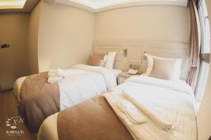 Postel nebo postele na pokoji v ubytování X-NELLYİ HOTEL