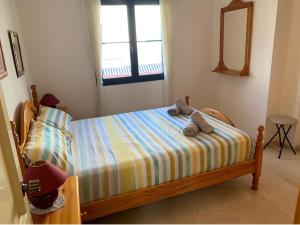 Un pat sau paturi într-o cameră la Vivienda Agaete Paradise