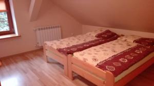 a bedroom with two beds in a room at Całoroczny dom GRODZIANKA in Banie Mazurskie +15 photos