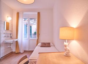 Ένα ή περισσότερα κρεβάτια σε δωμάτιο στο Saint Georges Hotel