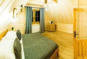 Posteľ alebo postele v izbe v ubytovaní Domek & Apartament Góralski z Jacuzzi Kościelisko