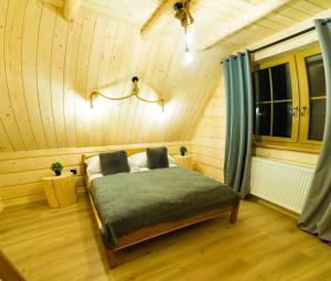 Posteľ alebo postele v izbe v ubytovaní Domek & Apartament Góralski z Jacuzzi Kościelisko
