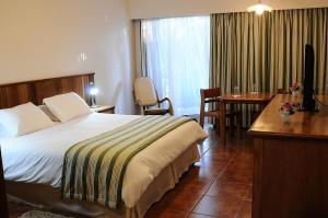 Ένα ή περισσότερα κρεβάτια σε δωμάτιο στο Hotel Passarim