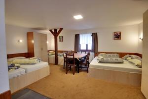 Postel nebo postele na pokoji v ubytování Apartmany Kadleců