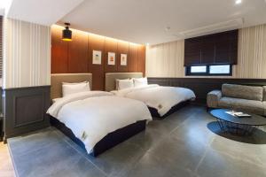Postel nebo postele na pokoji v ubytování Brown Dot Hotel Seomyeon