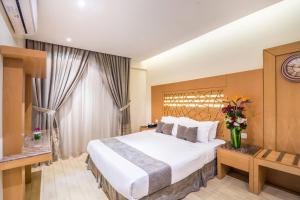 Llit o llits en una habitació de Al Muhaidb Al Malaz - Al Jamiah