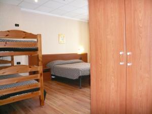 a room with two bunk beds and a bed at Albergo Belvedere in Scanno