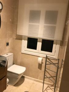 a bathroom with a toilet and a window at Dream View in Adeje