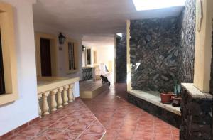 a hallway with a stone wall and a stone floor at Dream View in Adeje