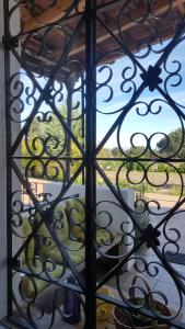 a view through a glass door of a window at El Condado Casa Rural in Fuentes de Oñoro