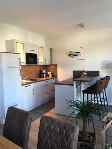 Kuchyň nebo kuchyňský kout v ubytování Ferienwohnung MeerZeitPerle + 10 fotografií