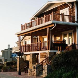 a large house with a balcony on the side of it at Shorelight Inn in Benicia