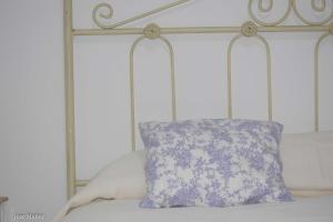 A bed or beds in a room at Santa Angela de la Cruz