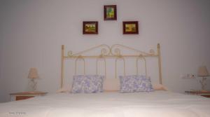 A bed or beds in a room at Santa Angela de la Cruz