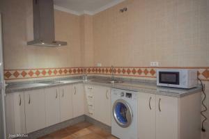A kitchen or kitchenette at Santa Angela de la Cruz Még 9 kép