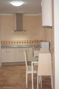A kitchen or kitchenette at Santa Angela de la Cruz