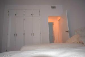 A bed or beds in a room at Santa Angela de la Cruz