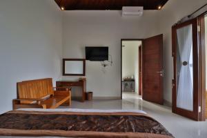 TV a/nebo společenská místnost v ubytování Arya Resort Nusa Penida