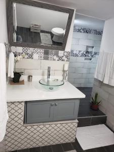 a bathroom with a sink and a toilet in it at Hill Retreat - Kingston in Kingston