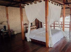 En eller flere senge i et værelse på Costa Beach Resort & Club