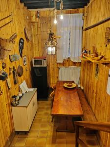 a kitchen with a wooden table in a room at La casa del pescatore: a lovely escape in Venice!! in Venice