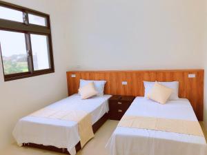 Postel nebo postele na pokoji v ubytování Yun Shan Shuei Country House