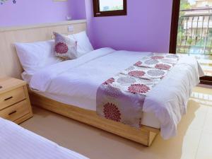 Postel nebo postele na pokoji v ubytování Yun Shan Shuei Country House