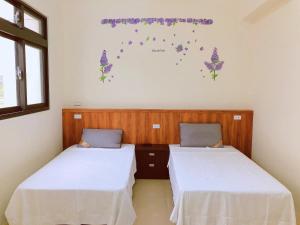 Postel nebo postele na pokoji v ubytování Yun Shan Shuei Country House