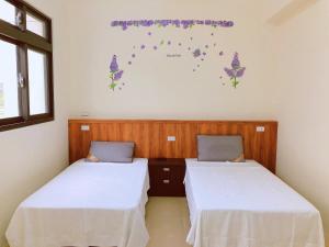 Yun Shan Shuei Country House tesisinde bir odada yatak veya yataklar