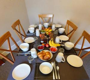 a table with a bunch of food on it at Doric House in Inverness
