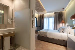 Voodi või voodid majutusasutuse Seasabelle Hotel near Athens Airport toas