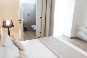 Postel nebo postele na pokoji v ubytování Vuvulà