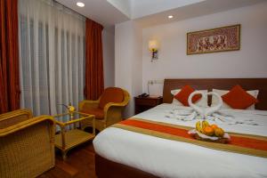 Ένα ή περισσότερα κρεβάτια σε δωμάτιο στο Apsara Boutique Hotel