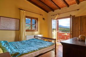 A bed or beds in a room at Villa Evenos of 3 bedrooms - Irida Country House of 2 bedrooms with private pools