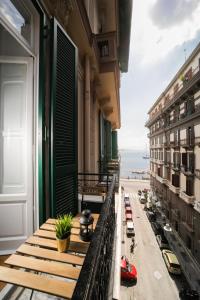 an apartment balcony with a view of the ocean at Di Palma Suite in Naples