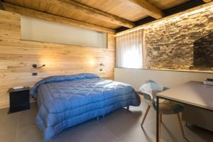 Uma cama ou camas num quarto em Borgotufi Albergo Diffuso
