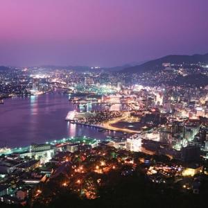 a view of a city at night with the water at Hotel Marine World in Nagasaki