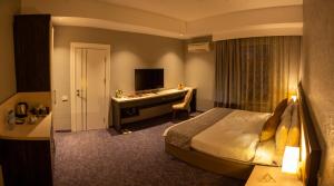 Postel nebo postele na pokoji v ubytování Parkway Inn Hotel & Spa