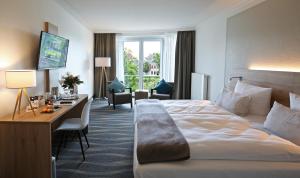 Postel nebo postele na pokoji v ubytování Quality Hotel Lippstadt + 34 fotografií