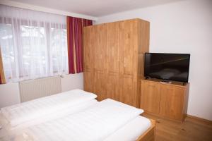 Posteľ alebo postele v izbe v ubytovaní Hotel Sonne
