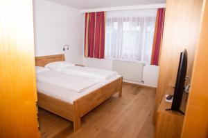 Posteľ alebo postele v izbe v ubytovaní Hotel Sonne
