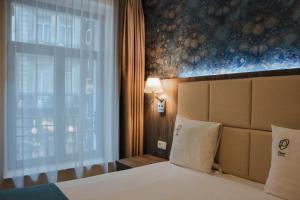 Cama o camas de una habitación en Dansaert Hotel