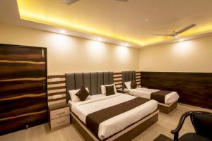 Postel nebo postele na pokoji v ubytování Hotel Mahajan International, Delhi Airport