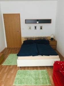 Tempat tidur dalam kamar di Apartmán Lucie Špindlerův Mlýn
