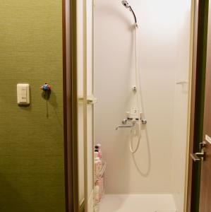 a bathroom with a shower with a glass door at Kiwi House Tokoname VACATION STAY in Tokoname