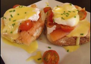 two hot dogs with cheese and tomatoes on a plate at No 12 B&B in Dungarvan