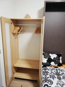 a bedroom with a bunk bed with a wooden closet at Tagusnunus in Brussels