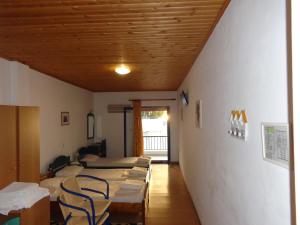 Ένα ή περισσότερα κρεβάτια σε δωμάτιο στο Πόρτο Καίρης +55 φωτογραφίες