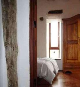 Postel nebo postele na pokoji v ubytování Castillo Gualisancho